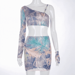 Sexy women's two-piece skirt set with an extra glove. This matching co-ord set is printed with a nice leaf and styled with a mini skirt and an asymmetrical one-shoulder crop top. To make sure to give all the available options to wear it on any occasion. 